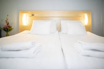 Фото номера Стандартный двухместный номер с 2 отдельными кроватями Отель Hotel Uusikuu г. Миккели 9